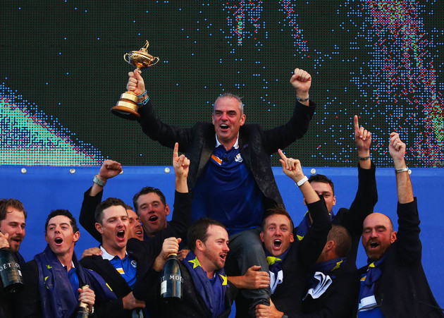 Get in there! Paul McGinley leads the European team's celebrations